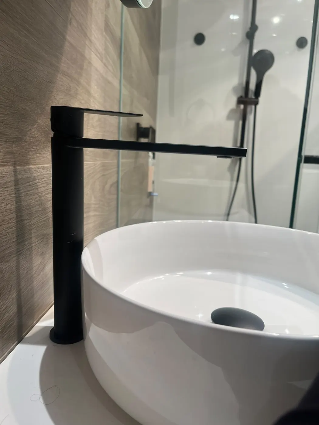 Vessel basin with matte black mixer