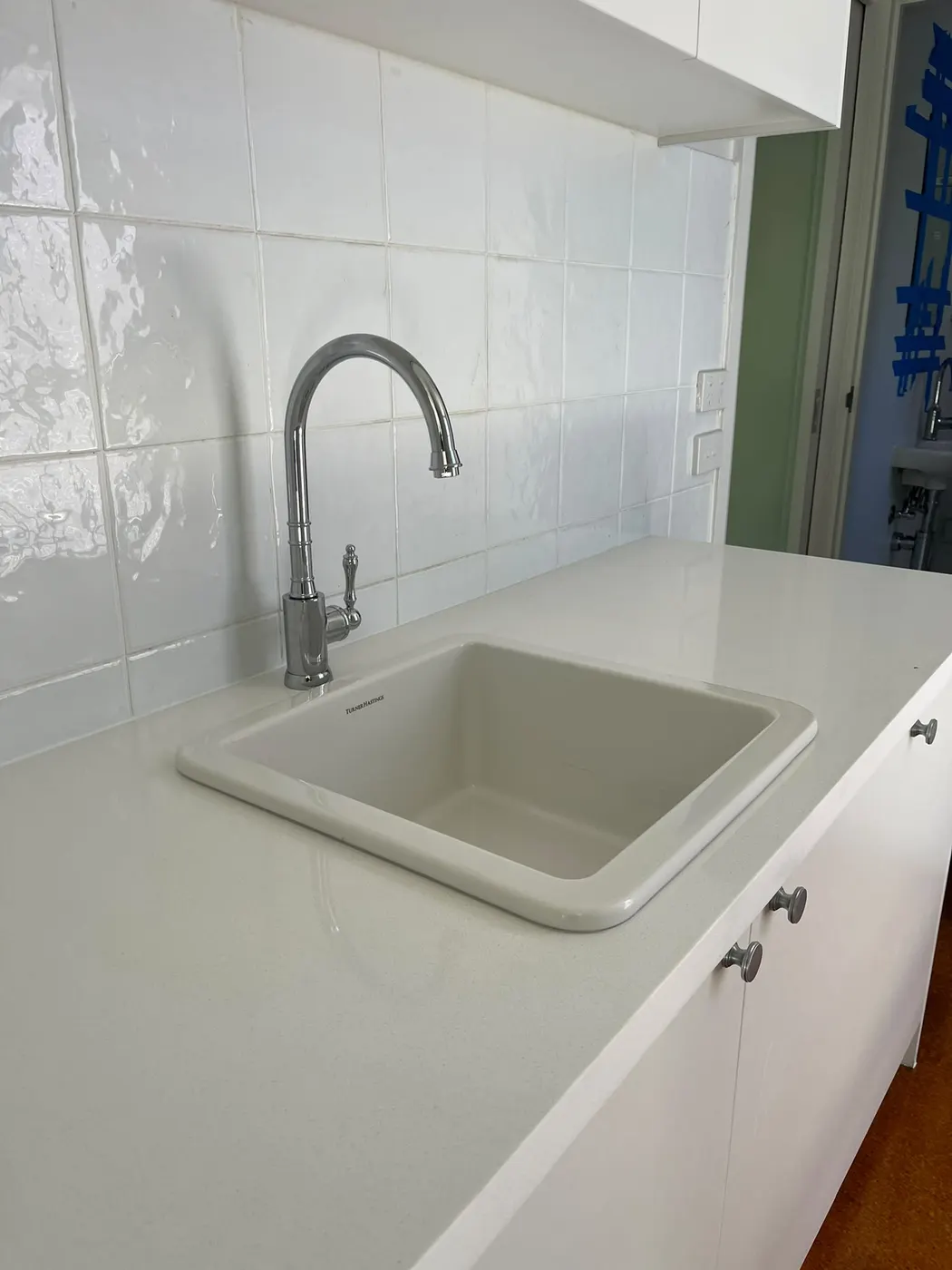 Butler sink with bridge mixer