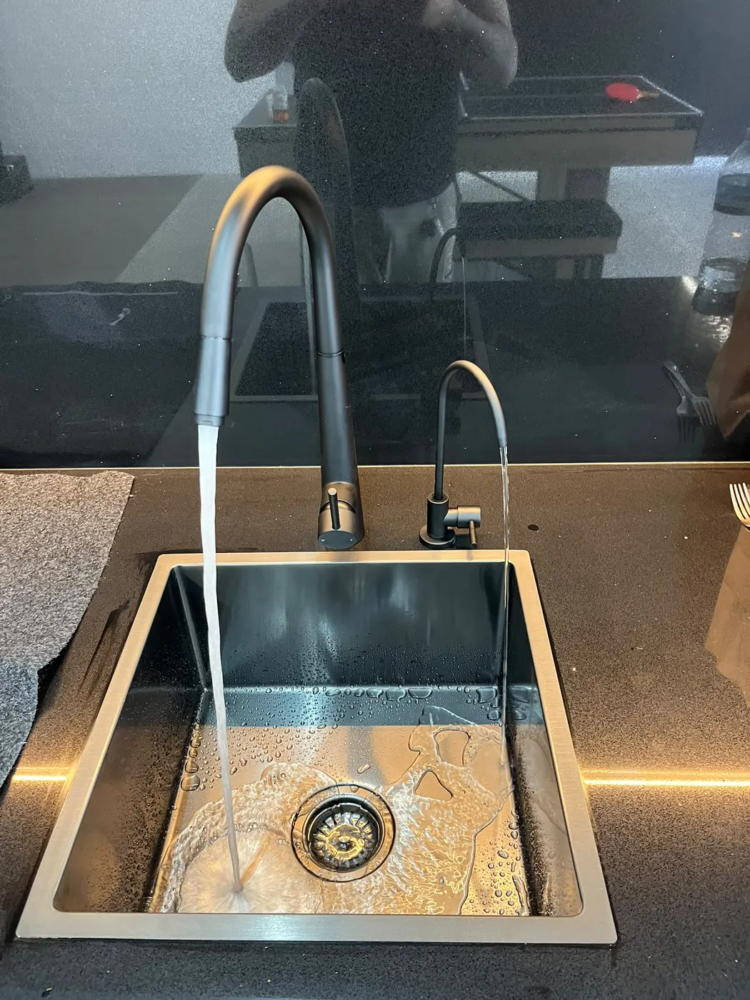 Kitchen sink with filtered water tap